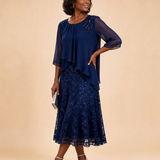 Lace | Morsiamen äidin sifonkimekko pitsikerroksella