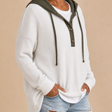 Irma | Neulottu hupullinen poncho napeilla